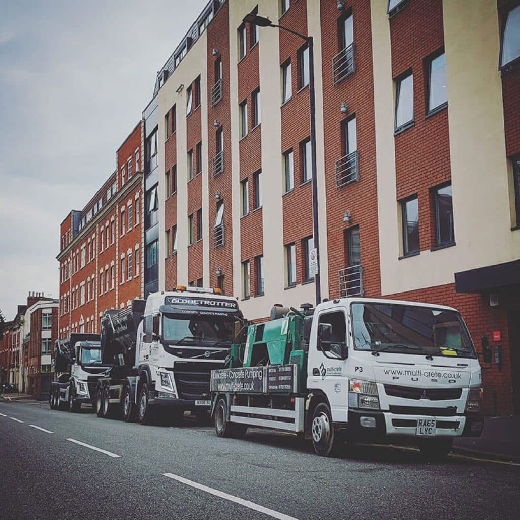 Multi Crete Vans parked outside building